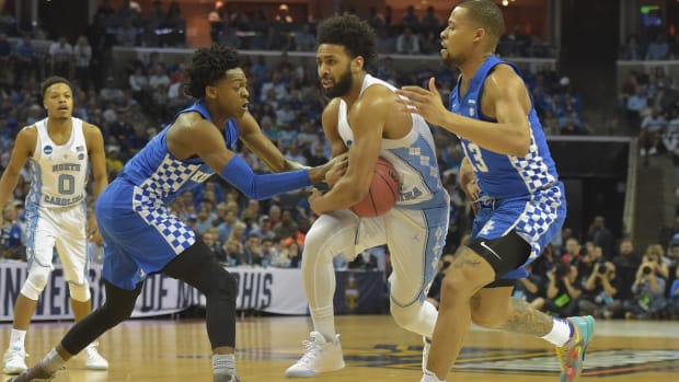 Kentucky Wildcats guards De'Aaron Fox and Isaiah Briscoe play defense.